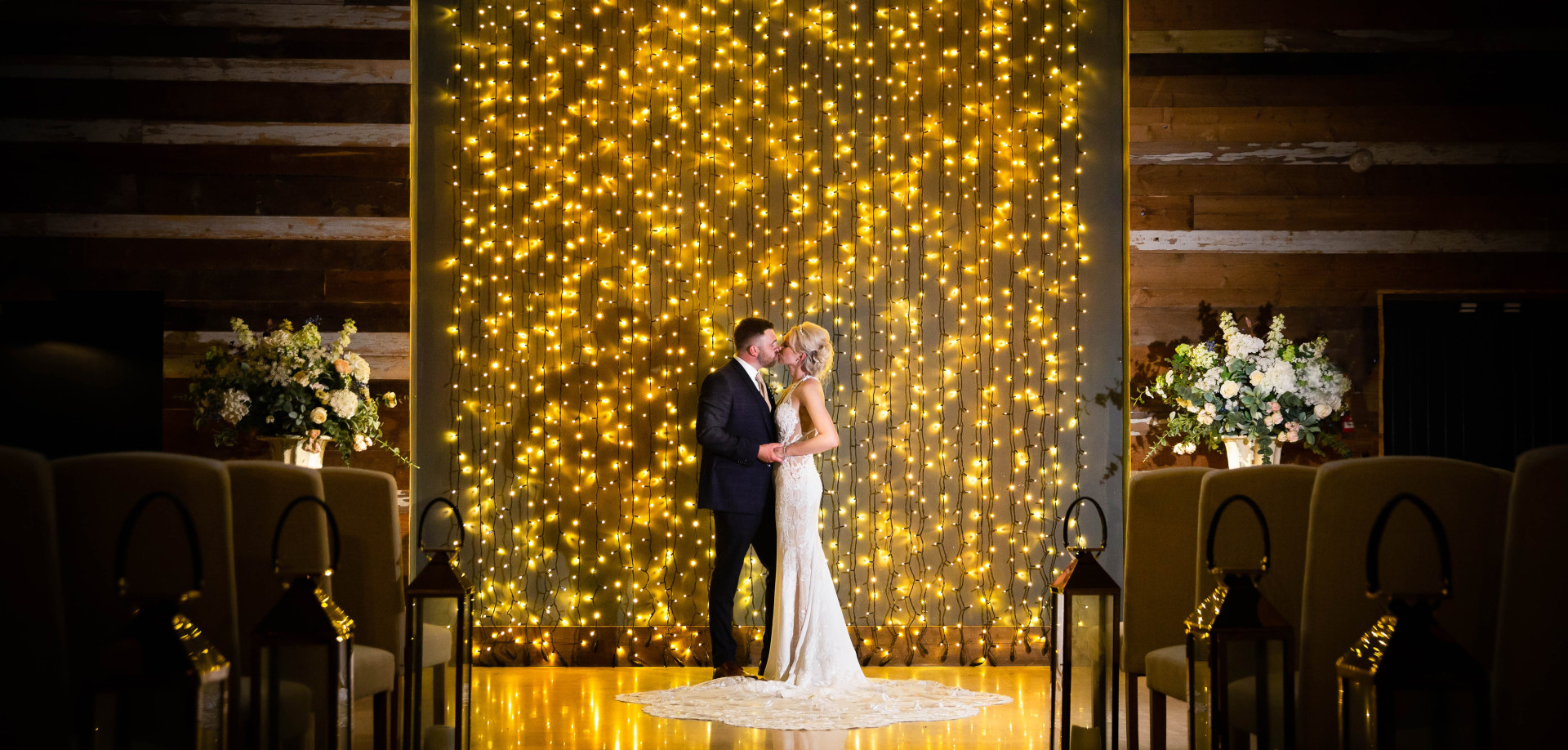 Wedding couple with night time lights - Peter Rollings Photography, weddings, family portraits, studio and professional