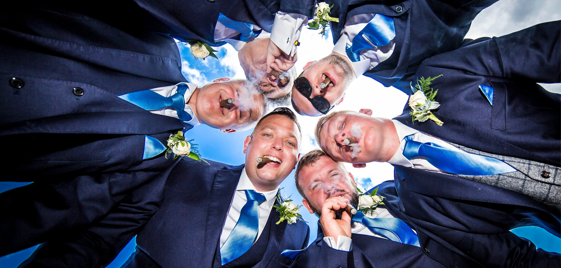 Groom and groomsmen with cigars - Peter Rollings Photography, weddings, family portraits, studio and professional